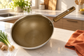Cal Kitchen stainless steel non-stick wok in a modern kitchen